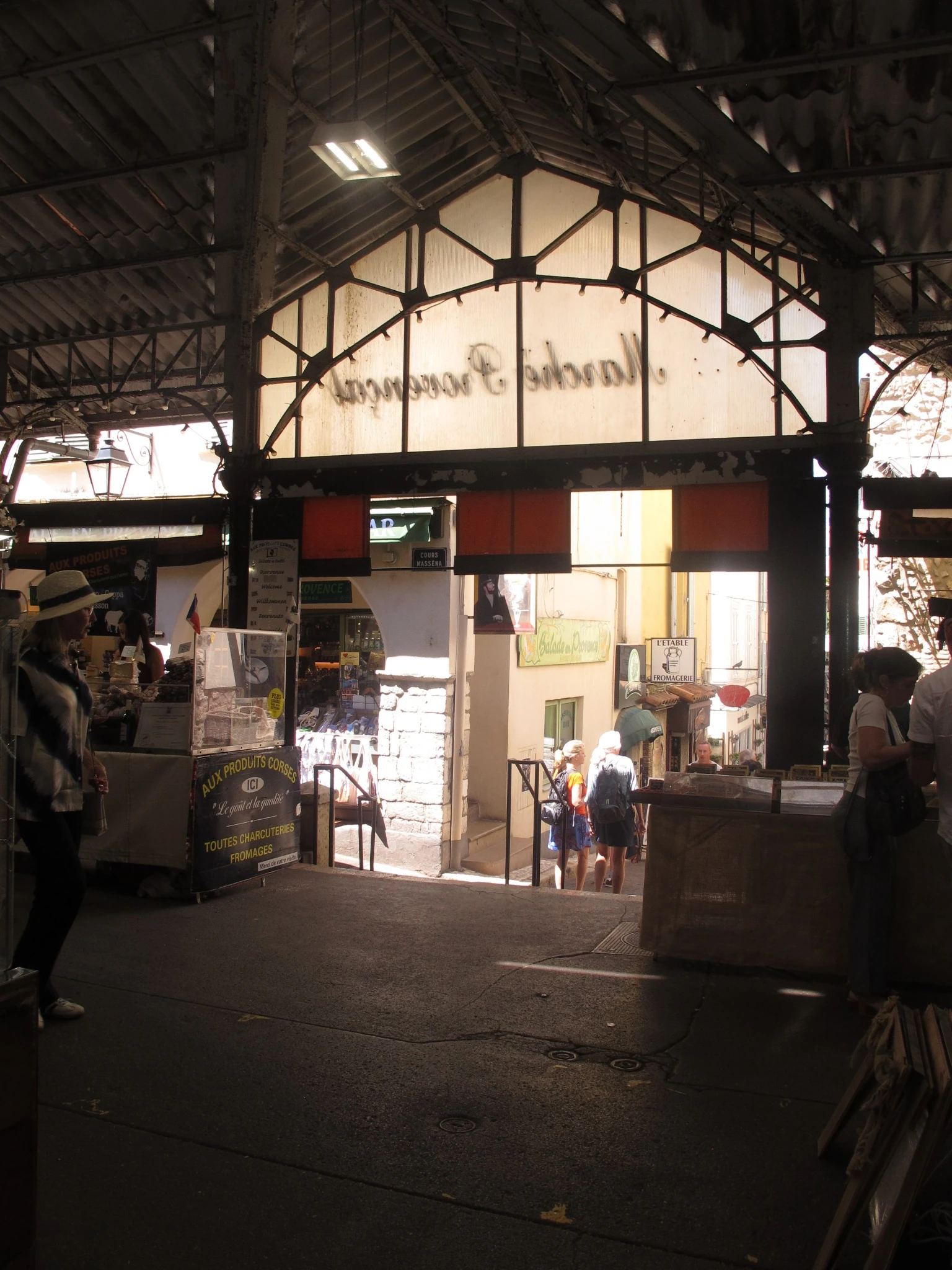 Covered Provençal market in contrasting light and shadow