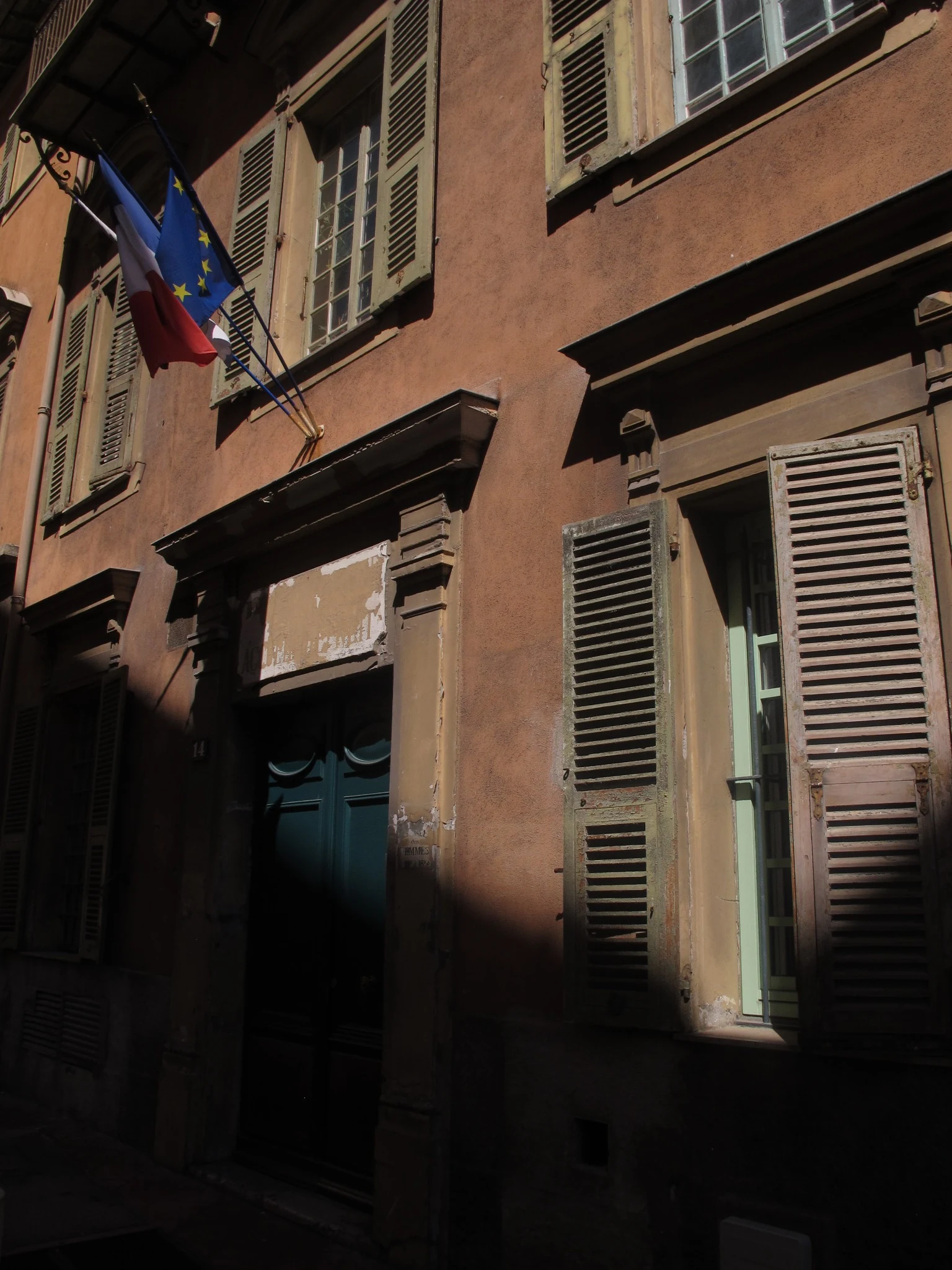 Weathered shutters and facade in France