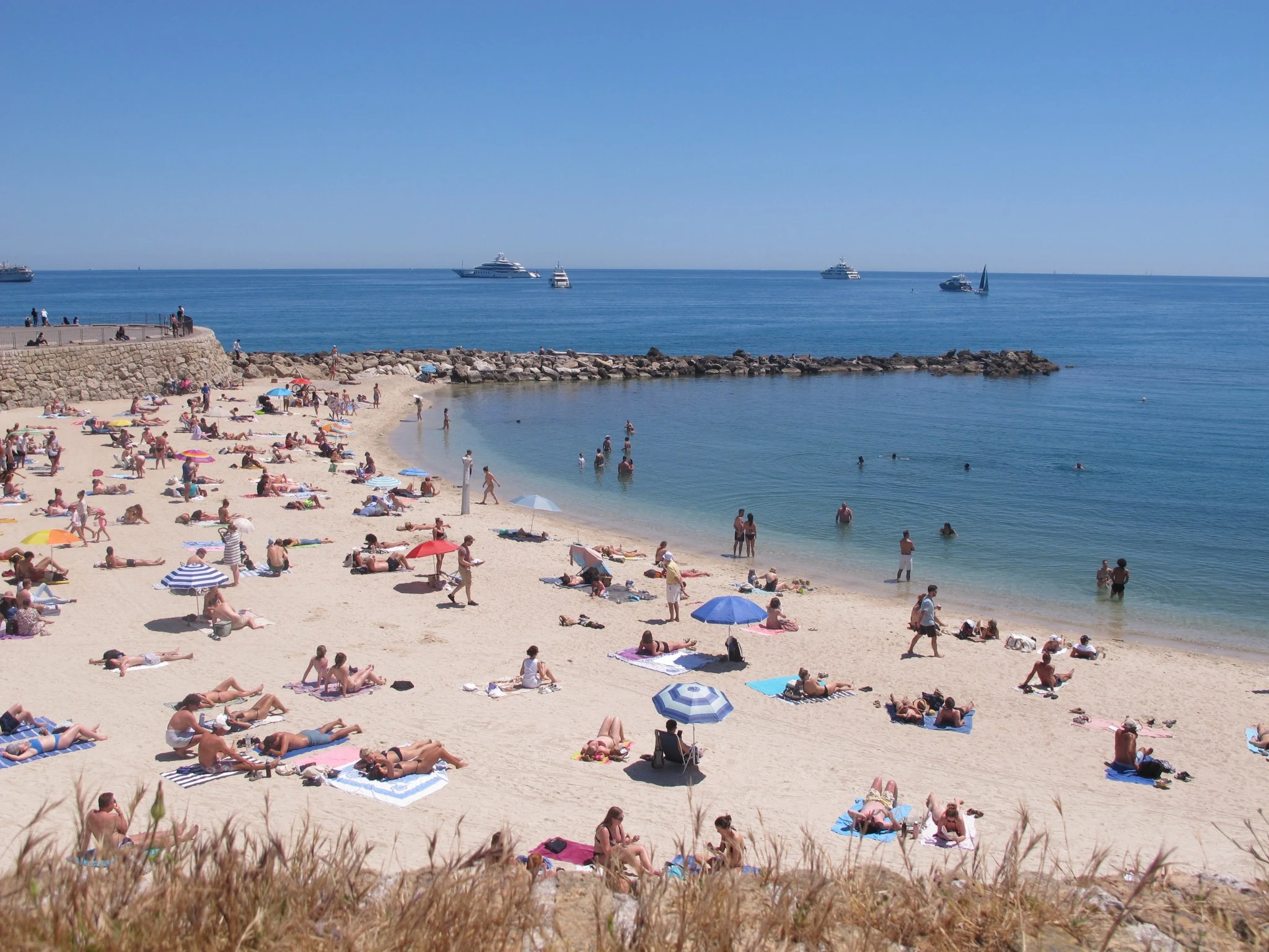Mediterranean beach and yachts